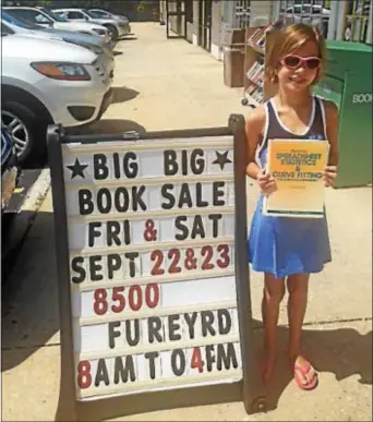  ??  ?? Upper Chichester Library visitor Laura Guy from Parkside donates books for the library’s annual Big Big Book Sale. There are many books during the event on Friday, Sept. 22-Saturday, Sept. 23, at the Upper Chichester Township Municipal Building, 8500...