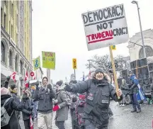  ?? ASHLEY FRASER • POSTMEDIA NEWS ?? Protesters rally in Ottawa against pandemic mandates. Extremism is more likely a symptom of civic illiteracy, rather than its cause, writes Carleton University political scientist Eric Van Rythoven.