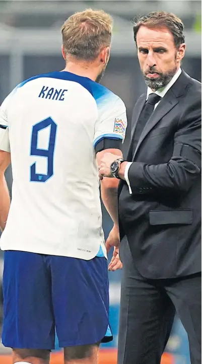  ?? ?? Gareth Southgate’s expression says it all as he consoles Harry Kane on Friday night and (right) after his miss