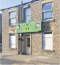  ??  ?? ●●The boarded-up windows at the Norden barbers following the incident