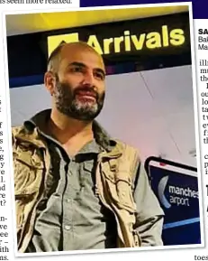  ?? ?? SAFE AT LAST: Smiling Bakhtiar Shoresh lands at Manchester airport