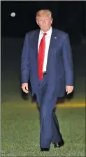  ?? AP PHOTO BY PABLO MARTINEZ MONSIVAIS ?? President Donald Trump walks across the South Lawn of the White House in Washington, Tuesday, following his arrival on Marine One helicopter from nearby Andrews Air Force Base. Trump was returning from a trip to Milwaukee.