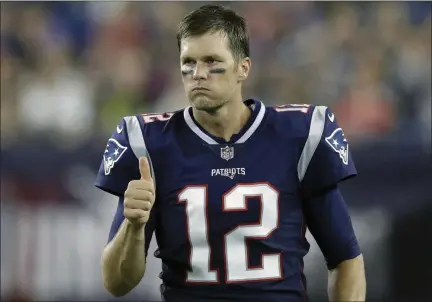  ?? CHARLES KRUPA - THE ASSOCIATED PRESS ?? In this Aug. 16, 2018, file photo, New England Patriots quarterbac­k Tom Brady signals a thumbs-up on the sideline during the second half of a preseason game against the Philadelph­ia Eagles in Foxborough, Mass.