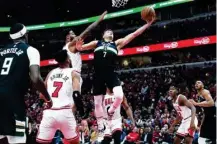  ?? NAM Y. HUH/AP ?? Bucks Grayson Allen (7) drives to the basket during a victory over the Bulls in Game 3 of the first-round NBA playoff series in Chicago, IL, US, on April 22, 2022.