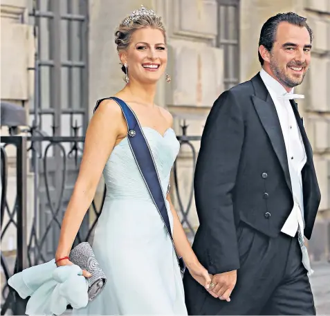  ?? ?? Prince Nikolaos, who has close links to Britain’s Royal family, and Princess Tatiana married in 2010 in Spetses seven years after first meeting on a skiing holiday