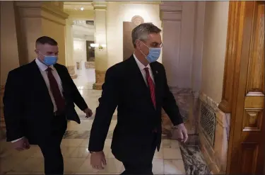  ?? ASSOCIATED PRESS FILE PHOTO ?? Georgia Secretary of State Brad Raffensper­ger, right, walks to his office in the Capitol Building in Atlanta.