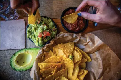  ?? ?? Chip dinner is its own thing, not to be confused with girl dinner. Photograph: Tiffany Hagler-Geard/Bloomberg via Getty Images