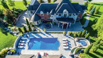  ?? DANIEL TEMOS PHOTOS/BIRCH HILL MEDIA GROUP ?? The backyard includes a pool, a guest house or cabana with a sitting area with a fireplace and three-piece bathroom, an outdoor kitchen, both opened and covered stone patios, terraces, and a built-in whirlpool.
