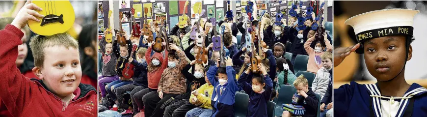  ?? PHOTO: STEPHEN JAQUIERY ?? The ukulele salute . . . Pupils hold ukuleles to their heads for the annual Dunedin Ukulele Jam at Kaikorai Valley College yesterday. Mornington School pupil Josh Hollander (6, left) shows off his uke while Concord School pupil Naomi Jones (9, right) performs a sailors dance.