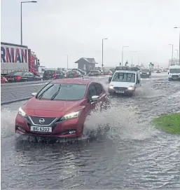  ??  ?? Kirkcaldy Esplanade was flooded during the torrential rain.