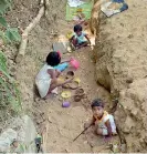  ??  ?? Children play in a waste water drain