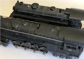  ??  ?? ▶ Early examples of the Lionel no. 671 steam turbine, including this one intended for the Electronic Control Set (front), also had smooth roofs. The author believes they were done mistakenly by a new employee at the Lionel factory, probably in 1946.