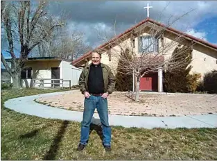  ?? COURTESY OF WENDY CLARE ?? The Rev. Wes Clare stands in front of St. Jude’s Anglican Church, located at 1200 S. Curry St.