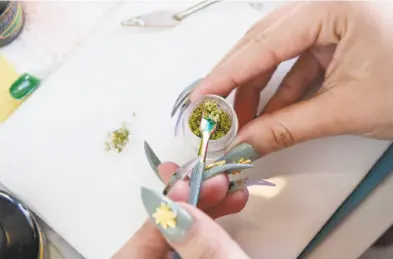  ?? Photos by Michael Short / Special to The Chronicle ?? Above, Christina Blea uses cannabis in Emily Earlenbaug­h’s manicure, left.