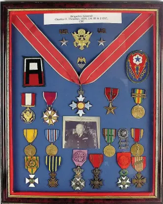  ??  ?? > The medals of Brigadier General Thrasher who played a key role managing D-Day