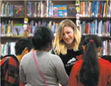  ?? Paul Chinn / The Chronicle ?? Library tech Trish Belenson saw her hours cut after transformi­ng Oakland’s Bella Vista Elementary School library.