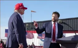  ?? Jeff Dean/Associated Press ?? U.S. Sen. J.D. Vance points toward Republican presidenti­al candidate Donald Trump at a campaign rally on March 16 in Vandalia, Ohio.