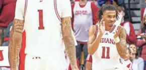  ?? ?? Indiana’s CJ Gunn (11) celebrates during the second half against Ohio State on Saturday at Simon Skjodt Assembly Hall in Bloomingto­n.