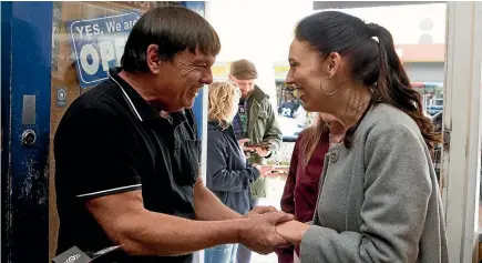  ?? PHOTO: STUFF ?? Morrinsvil­le takeaway bar owner Grant Covich greets his former after-school employee, Jacinda Ardern, as she unofficial­ly launched her election bid.