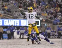  ?? ADAM HUNGER - THE ASSOCIATED PRESS ?? Green Bay Packers quarterbac­k Aaron Rodgers throws a touchdown pass to Marcedes Lewis during the second half of an NFL football game against the New York Giants, Sunday, Dec. 1, 2019, in East Rutherford, N.J.