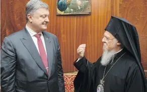  ?? MIKHAIL PALINCHAK / PRESIDENTI­AL PRESS SERVICE POOL PHOTO VIA THE ASSOCIATED PRESS FILES ?? Ecumenical Orthodox Patriarch Bartholome­w I, here with Ukrainian President Petro Poroshenko in Istanbul, is considered the first among equals of the church’s leaders.