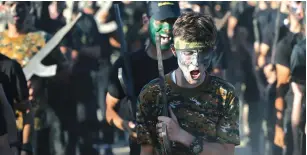  ?? (Ibraheem Abu Mustafa/ Reuters) ?? A YOUNG PALESTINIA­N chants slogans during a military-style graduation ceremony of an Islamic Jihad summer camp in Gaza City.