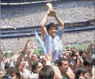  ?? Carlo Fumagalli / Associated Press ?? Diego Maradona holds up his team’s trophy after Argentina’s 3-2 victory over West Germany at the World Cup final soccer match in 1986.