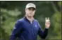  ?? MICHAEL DWYER — THE ASSOCIATED PRESS ?? Justin Thomas holds up his ball after finishing on the 18th hole during the third round of the Dell Technologi­es Championsh­ip golf tournament at TPC Boston in Norton, Mass., Sunday.