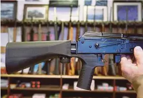  ?? AFP PIC ?? A bump stock installed on a AK-47 semi-automatic rifle at a gun store in Salt Lake City, Utah, on Thursday.