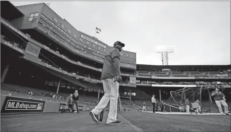  ?? CHARLES KRUPA/AP PHOTO ?? Red Sox designated hitter David Ortiz heads out to hit during a team practice on Saturday at Fenway Park in Boston.