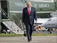  ?? THE ASSOCIATED PRESS ?? President Donald Trump walks across the tarmac from Marine One to board Air Force One at Morristown Municipal Airport in Morristown, N.J.