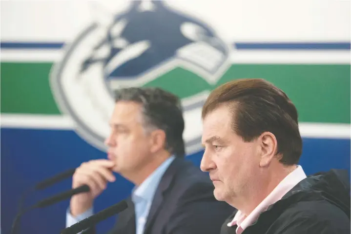  ?? — JASON PAYNE/FILES ?? Canucks general manager Jim Benning, right, here with head coach Travis Green, is “trying to figure out a bunch of logistics” regarding the return to play.