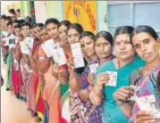  ?? PTI ?? Voters show their ID cards as they wait in a queue at a polling booth at Hundi village in Mysore on Saturday. The counting of votes will take place on Tuesday, May 15.