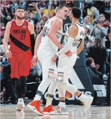  ?? DAVID ZALUBOWSKI
THE ASSOCIATED PRESS ?? Nuggets’ Nikola Jokic celebrates a basket with Kitchener’s Jamal Murray, right, against the Portland Trail Blazers on Sunday in Denver.