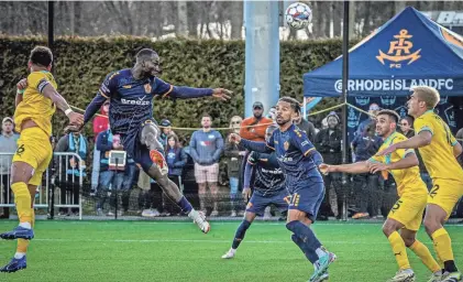  ?? PHOTOS BY DAVID DELPOIO/PROVIDENCE JOURNAL ?? Rhode Island FC’s Albert Dikwa puts a header on net in Saturday’s season-opening game.