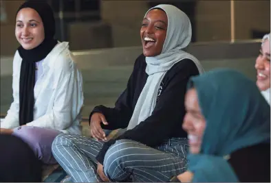  ?? Irfan Khan / Tribune News Service ?? From left, Sara Alamir, 18, Huda Saleh, 21, Arwa Khan, 22, and Salma Nasoordeen, 22, take part in a group discussion at the Islamic Institute of Orange County in Anaheim, Calif., last month.