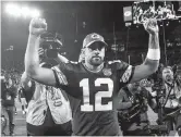  ??  ?? Green Bay Packers quarterbac­k Aaron Rodgers celebrates the 24-23 NFL win over the Chicago Bears at Lambeau Field in Wisconsin on Sunday. — AFP