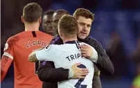  ?? AFP ?? Tottenham coach Mauricio Pochettino embraces defender Kieran Trippier after their 6-2 win over Everton on Sunday. —