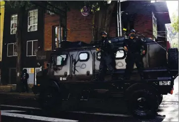  ?? MARCO UGARTE — THE ASSOCIATED PRESS ?? A police vehicle arrives to the place where an abandoned vehicle that is believed to have been used by gunmen in an attack against the chief of police was found in Mexico City on Friday.