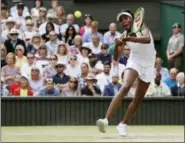  ?? KIRSTY WIGGLESWOR­TH — THE ASSOCIATED PRESS ?? Venus Williams returns to Johanna Konta in London Thursday.