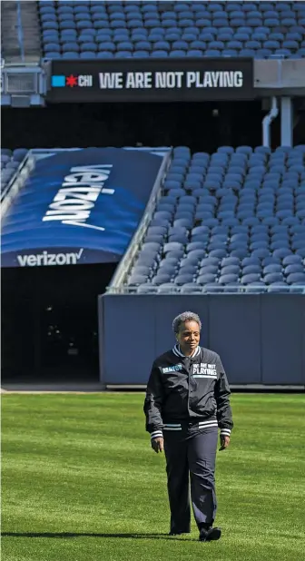  ?? ASHLEE REZIN GARCIA/SUN-TIMES ?? Mayor Lori Lightfoot visited Soldier Field for a news conference to announce the “We Are Not Playing” campaign in April. On Friday, she called for the Bears to provide “specific, concrete plans.”