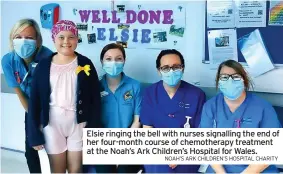  ?? NOAH’S ARK CHILDREN’S HOSPITAL CHARITY ?? Elsie ringing the bell with nurses signalling the end of her four-month course of chemothera­py treatment at the Noah’s Ark Children’s Hospital for Wales.
