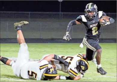  ?? Jeremy Stewart ?? Rockmart’s JoJo Haynes (2) evades tackles from two North Murray players as he runs to the outside during the second quarter of Friday’s game at Rockmart High School. The Jackets took command of the game in the second half on the way to a 34-14 win.