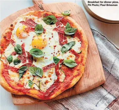  ?? ?? Breakfast for dinner pizza. PA Photo/Paul Brissman