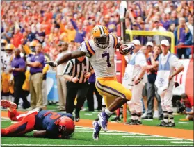  ?? AP PHOTOS ?? LSU running back Leonard Fournette (7) gets past Syracuse cornerback Wayne Morgan (2) for a touchdown.