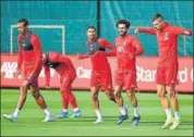  ??  ?? Liverpool’s Mohamed Salah with teammates at practice
AFP