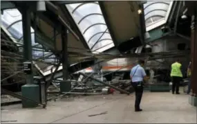  ?? THE ASSOCIATED PRESS ?? This photo provided by a passenger who was on the train when it crashed shows wreckage at the Hoboken, N.J. rail station. The commuter train barreled into the station during the Thursday morning rush hour, coming to a halt in a covered area between the...