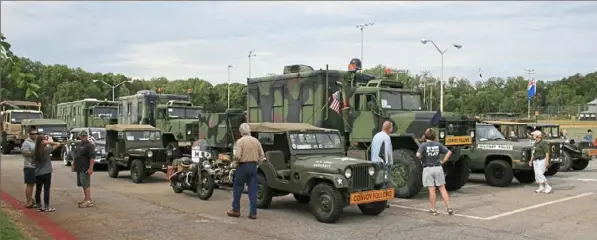  ?? Walter Schroth ?? The Military Vehicle Preservati­on Associatio­n regularly runs convoys of vehicles on various routes, such as this one along Bankhead Highway in Alabama in 2015. A convoy of 60 military vehicles is traveling from York, Pa., to San Francisco to mark the centennial of a 1919 Army convoy on the Lincoln Highway.