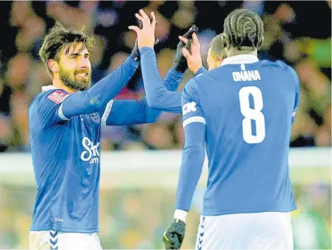  ?? AP ?? Everton’s Andre Gomes celebrates scoring the first goal with teammates in their English FA Cup third-round replay against Crystal Palace at Goodison Park, Liverpool, England, yesterday. Everton won 1-0.