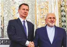  ?? AFP ?? Iran’s Foreign Minister Mohammad Javad Zarif with UK Foreign Secretary Jeremy Hunt in Tehran yesterday.